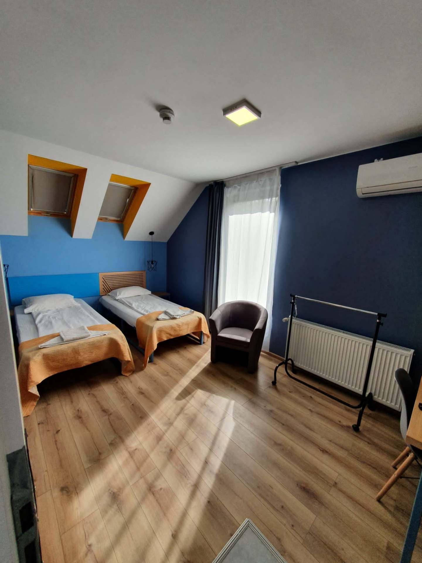 Sunlit twin attic room