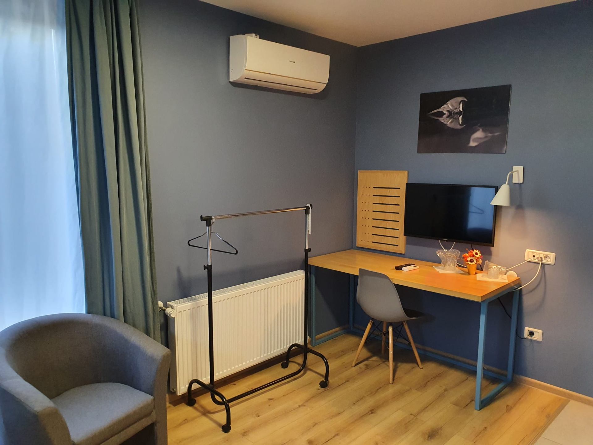 Workspace corner with desk and TV