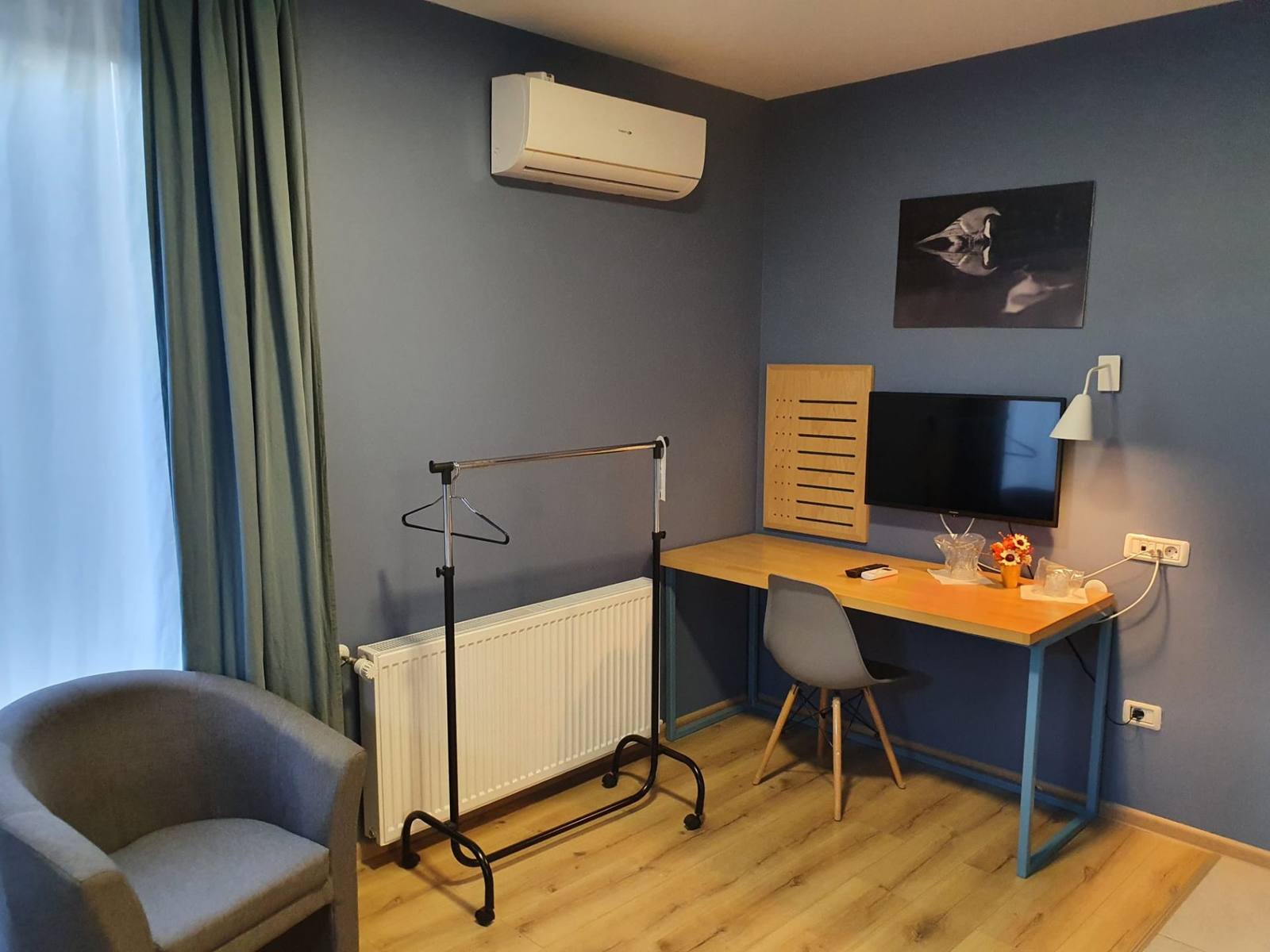 Workspace corner with desk and TV